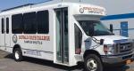 New shuttle bus with Buffalo State advertising on the side