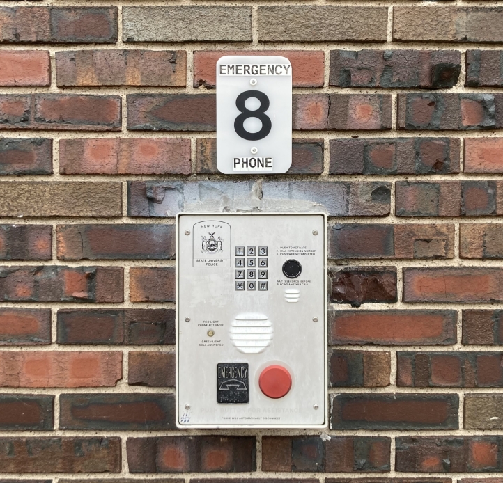 image of blue light phone wall box on campus