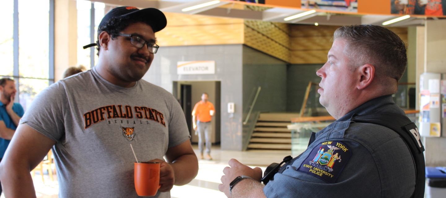 image of UPD officer conversing with student in CSU